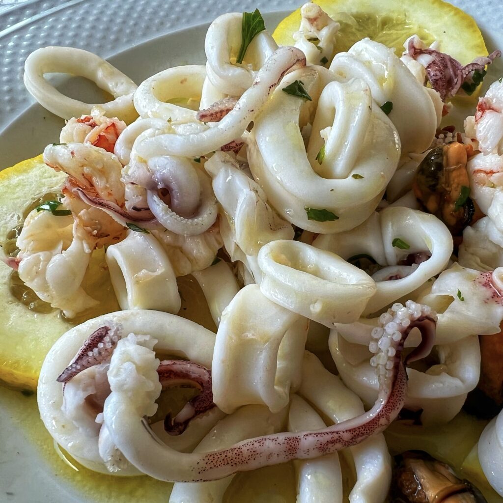 Insalata di mare, Al Canale, Taranto. Puglia by food. A virtual tour of Puglia’s best food, dishes, restaurants. Puglia is one of Italy’s top foodie destinations | Photo © the Puglia Guys for the Big Gay Podcast from Puglia guides to gay Puglia, Italy’s top gay summer destination for LGBT travel.