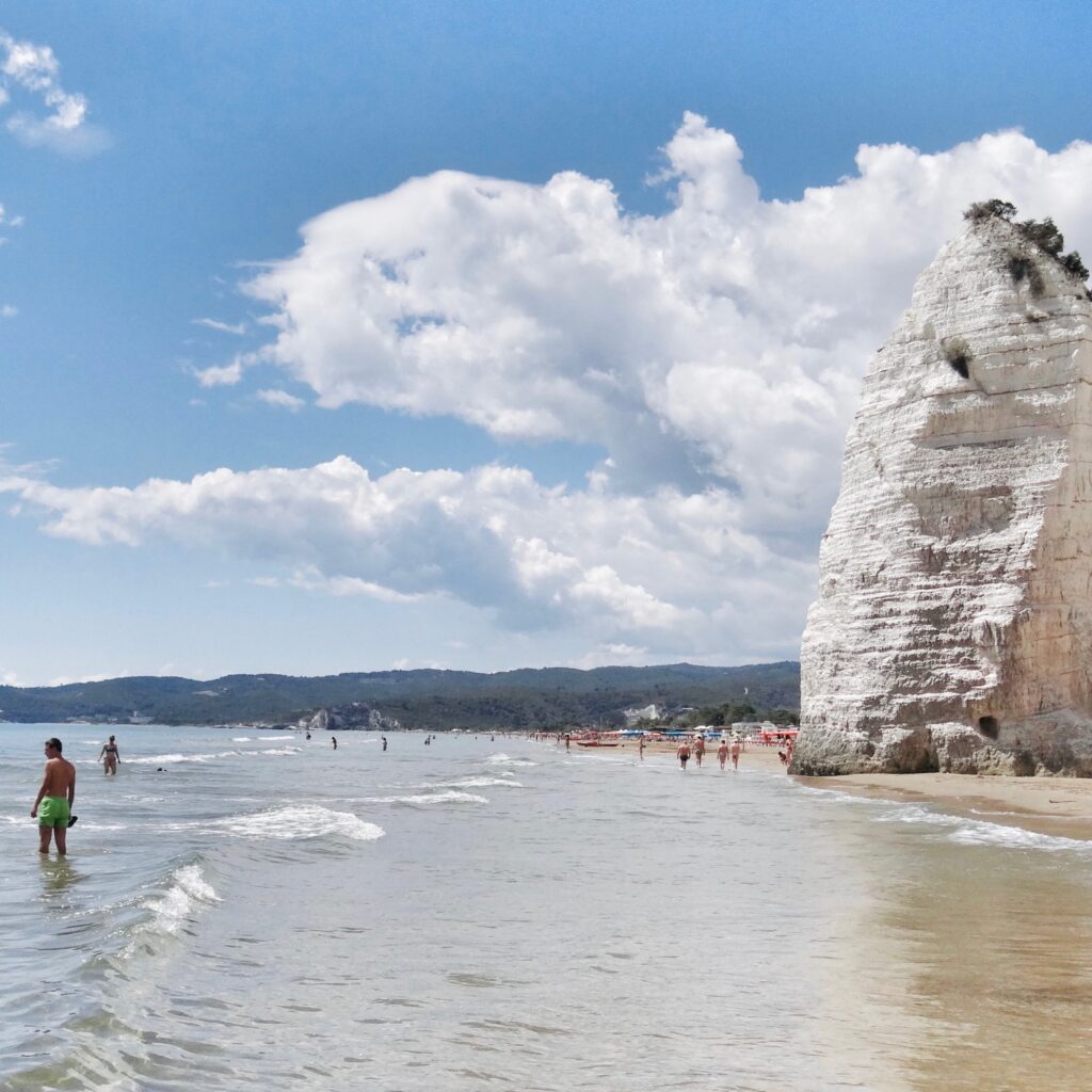 Spiaggia del Castello or Scialara or sometimes Pizzomunno beach, Vieste | Photo © the Puglia Guys for the Big Gay Podcast from Puglia guides to gay Puglia, Italy’s top gay summer destination | Puglia by beach guide to Puglia’s best beaches