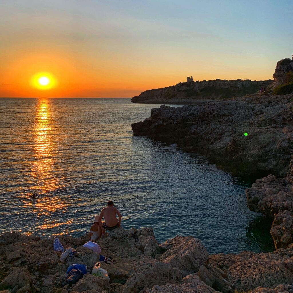 Porto Selvaggio gay beach, situated in a nature reserve, is a popular local beach with rocks | Photo © the Puglia Guys for the Big Gay Podcast from Puglia guides to gay Puglia, Italy’s top gay summer destination