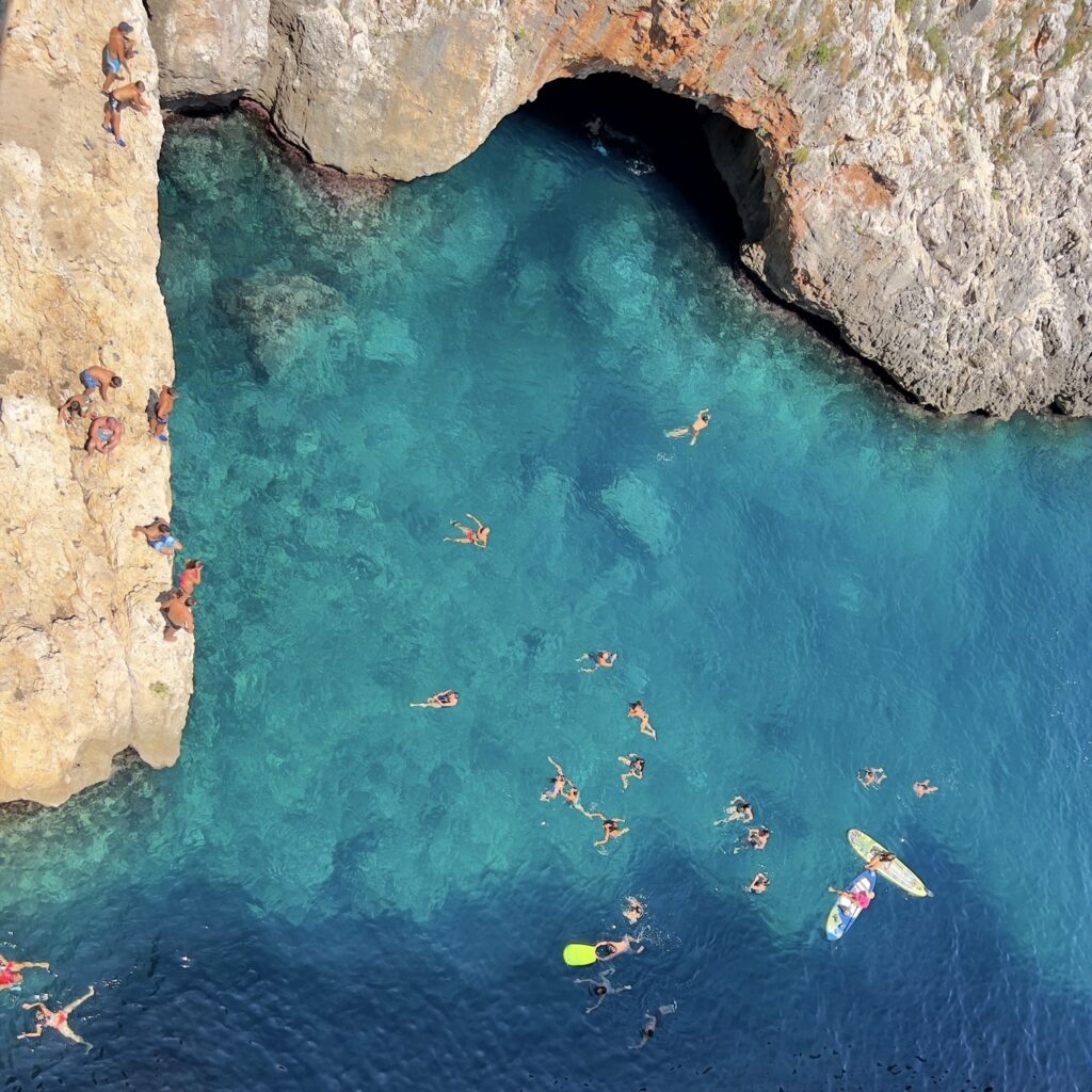 Il Ciolo, Gagliano del Capo - one of Puglia’s most beautiful swimming spots, in a dramatic canyon underneath a bridge | Photo © the Puglia Guys for the Big Gay Podcast from Puglia guides to gay Puglia, Italy’s top gay summer destination