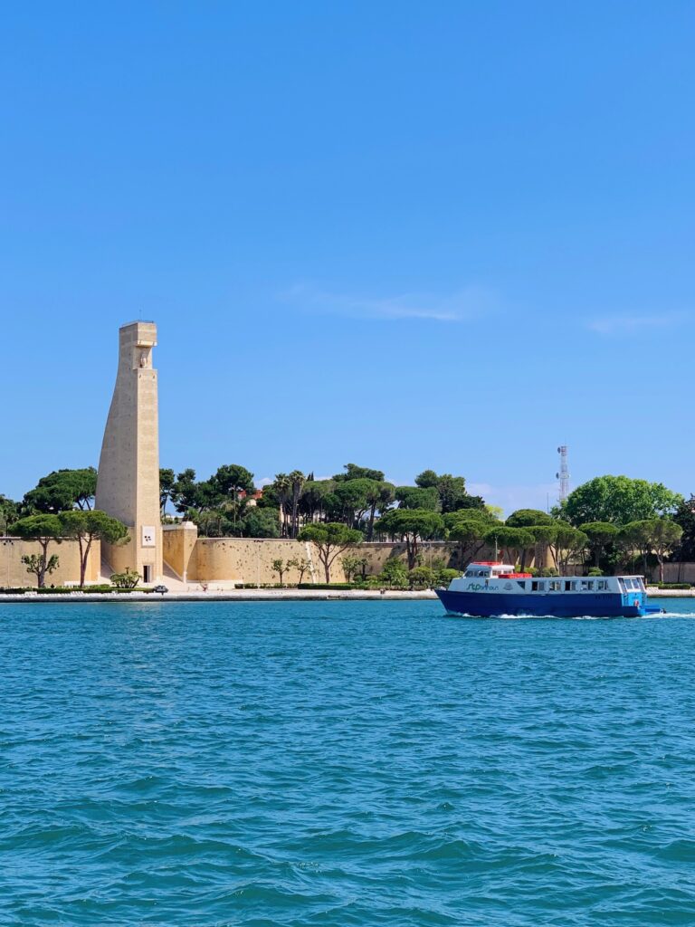 Brindisi lungomare with the Monument to the Italian Sailor in the background | Photo © the Puglia Guys for the Big Gay Podcast from Puglia, city guides and guides to Puglia’s best restaurants, accommodation and things to to in Puglia, Italy’s top gay summer destination for LGBT travel.