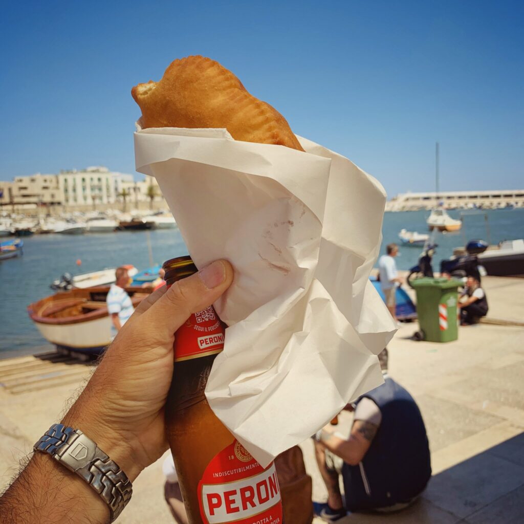 Panzerotto and peroni, epic street food served up at Bari’s porto vecchio   | Photo © the Puglia Guys for the Big Gay Podcast from Puglia, city guides and guides to Puglia’s best restaurants, accommodation and things to to in Puglia, Italy’s top gay summer destination for LGBT travel.