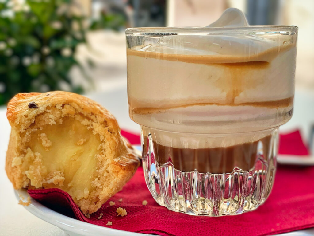 A pasticciotto from Puglia with an espressino freddo. Enjoy Puglia’s traditional breakfast and caffè culture at the bar. Photograph ©️ the Puglia Guys.