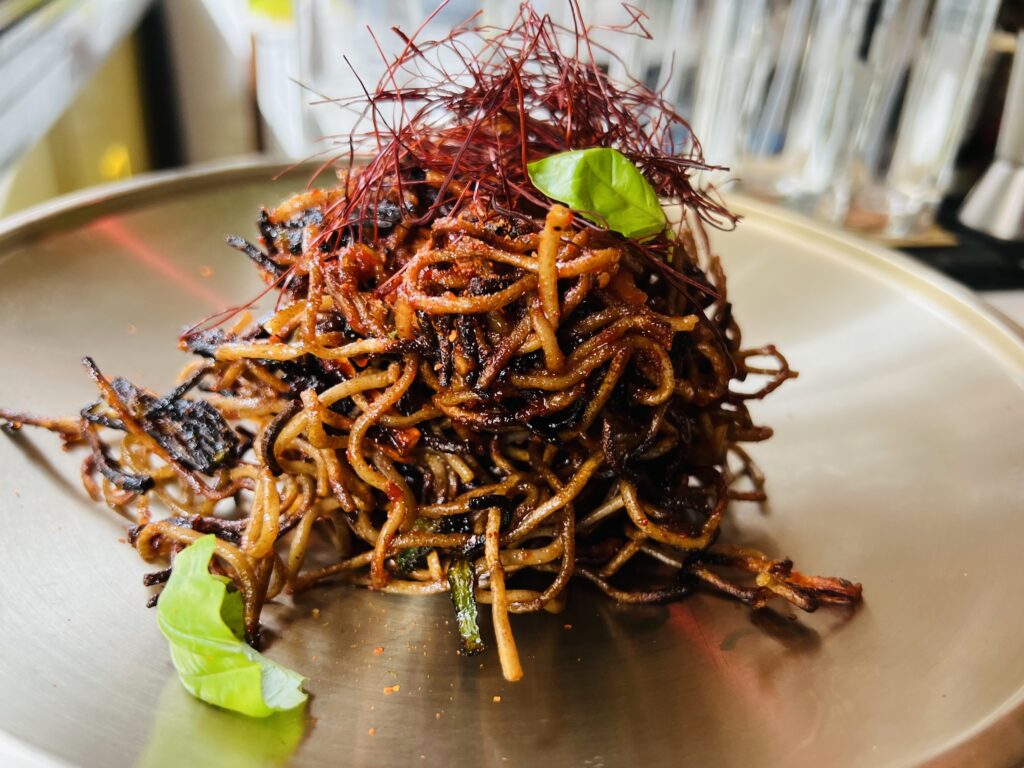U’Kor’s spaghetti all’assassina is fantastic. Made with rice noodle, thinner, and crisper - and beautifully burnt. Photo copyright©️the Puglia Guys.