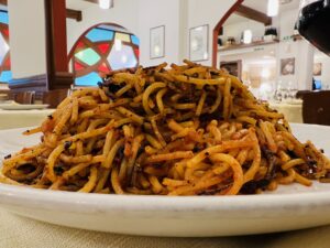 Spaghetti all’assassina from Bari. Al Sorso Preferito where spaghetti all’assassina was invented. No homage to the dish would be complete without visiting the restaurant where spaghetti all’assassina was born. Photo copyright the Puglia Guys.