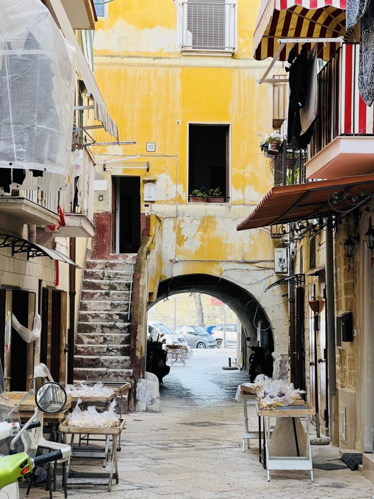 Orecchiette, troccoli, cavateli: in Strada Arco Basso, the heart of old Bari, watch the famous Bari ladies who prepare and sell fresh pasta on their doorstep. These ‘nonne’ have transitioned from tradition into legend! Photo copyright ©️ the Puglia Guys.