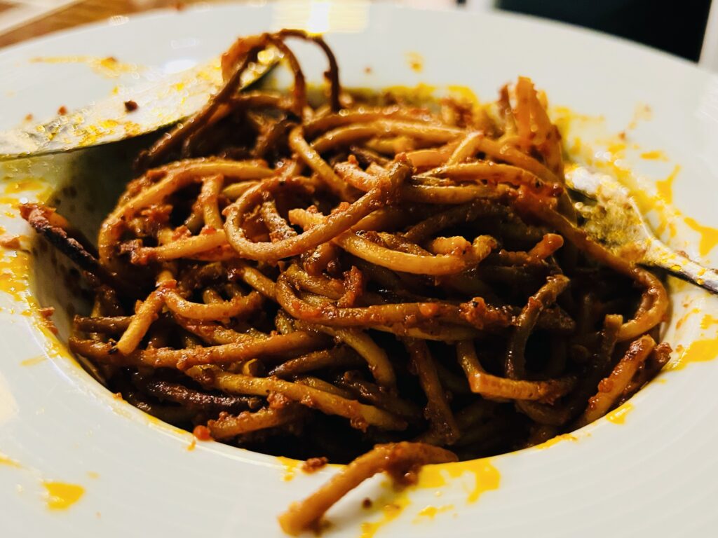 Spaghetti all’assassina from Bari, Puglia. Also known as spaghetti brucati Barese (burnt spaghetti from Bari). Cooked by the Puglia Guys using an authentic assassina recipe.