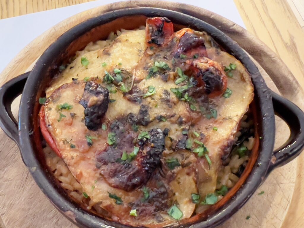 Tiella di patate, riso e cozze. One of Bari’s best known dishes. A wonderful dish of potato, rice and mussels baked in layers in a terracotta dish. Photo the Puglia Guys.