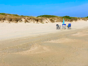 Surviving Italy’s Caronte Heat Storm: Top Tips to Stay Cool And Enjoy Your Summer - make your own shade. Photo by the Puglia Guys. Pilone beach, Ostuni