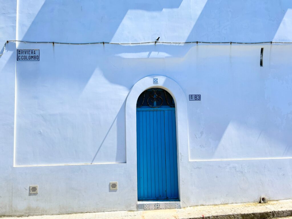 Gallipoli, Puglia. By day its fishermen residents sit in cool shade forged out of sun-soaked alleys lined by whitewashed facades, the Greek influence ever present. Photo the Puglia Guys.