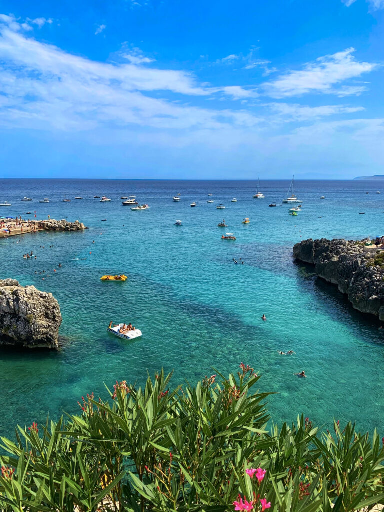 Castro. A small Salento seaside town with a picturesque harbor. A public beach with rocky shelves and concrete piers, popular with locals and visitors all summer long. Photo copyright ©️ the Puglia Guys.
