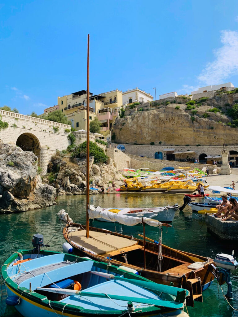 Castro. A small Salento seaside town with a picturesque harbor. A public beach with rocky shelves and concrete piers, popular with locals and visitors all summer long. Photo copyright ©️ the Puglia Guys.