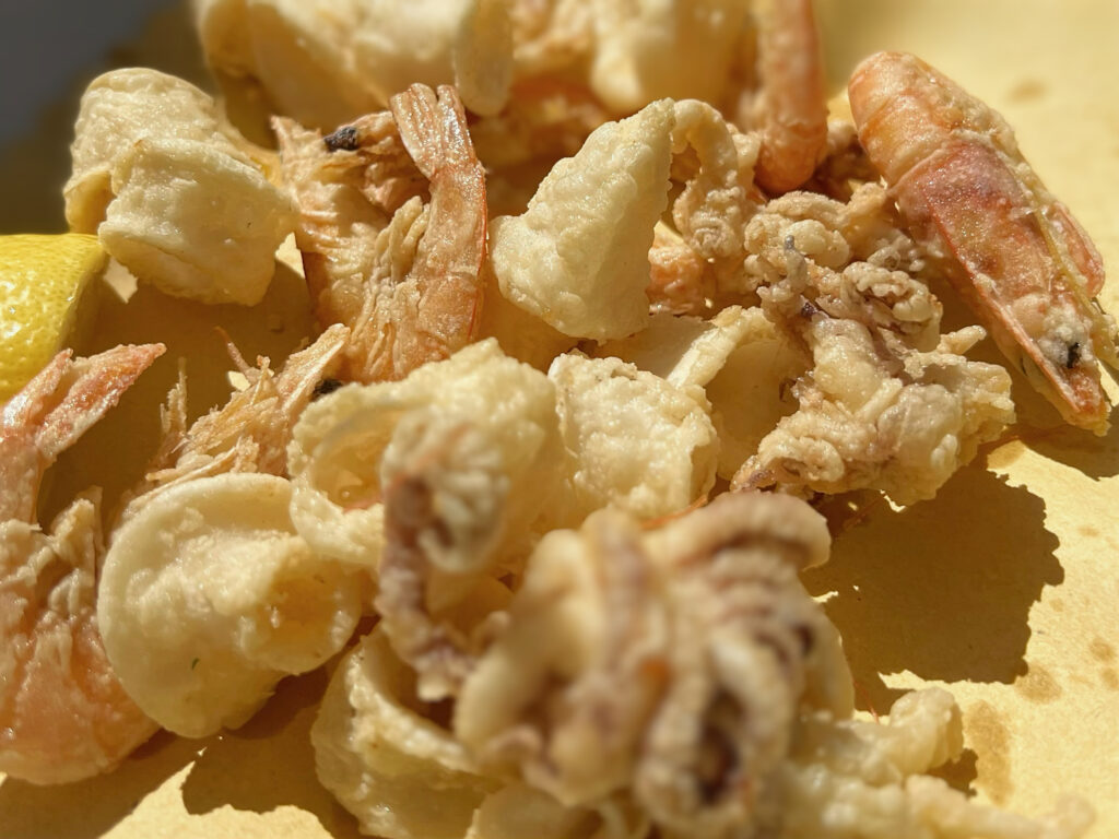 For a unique experience, visit one of the local freid seafood bars along the seaside promenade in Castro Marina. They serve freshly caught and fried fish, perfect for a quick and delicious snack.