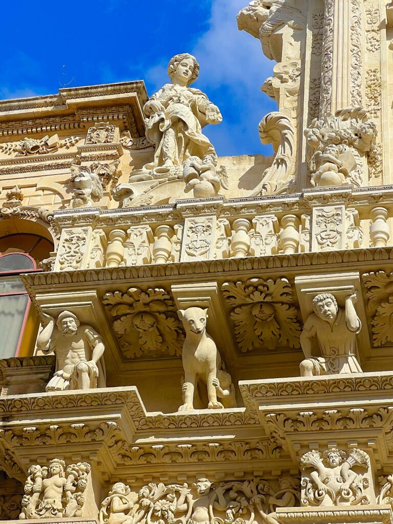 the astonishing Basilica of Santa Croce. Take your time to contemplate its facade, only recently revealed after years of restoration works. The detail - made possible by the soft Lecce limestone - is astonishing. Flowers, fruits, cherubs, mythical figures, animals and sculpted figures almost seem to form an external altar. Photo the Puglia Guys for the Lecce Guide