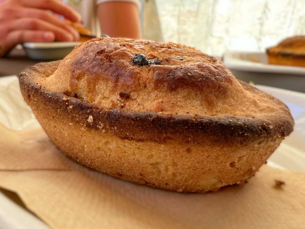 A pasticciotto from Lecce. A traditional pastry from Lecce, Puglia, eaten across Salento and Puglia. Photograph by the Puglia Guys, Puglia ambassadors, for the Puglia Guys Lecce guide. PugliaGuys.com