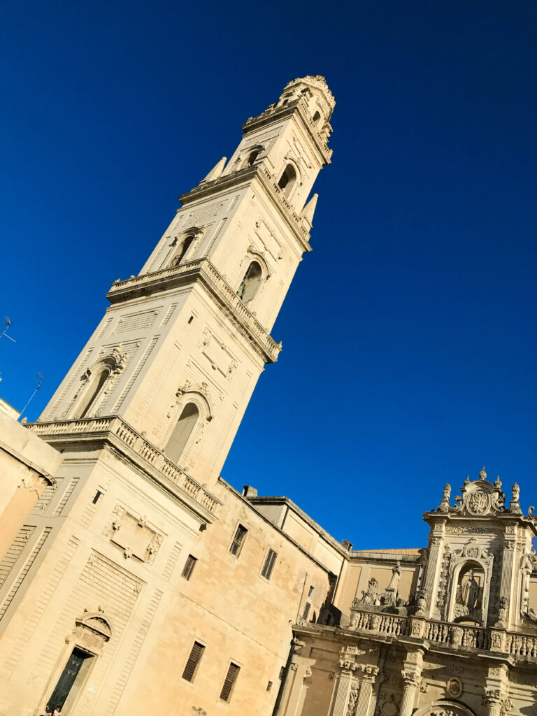 The Duomo bell tower campanile (the tallest structure in Lecce) in the Piazza del Duomo, Lecce. Photograph by the Puglia Guys, Puglia ambassadors, for the Puglia Guys Lecce guide. PugliaGuys.com